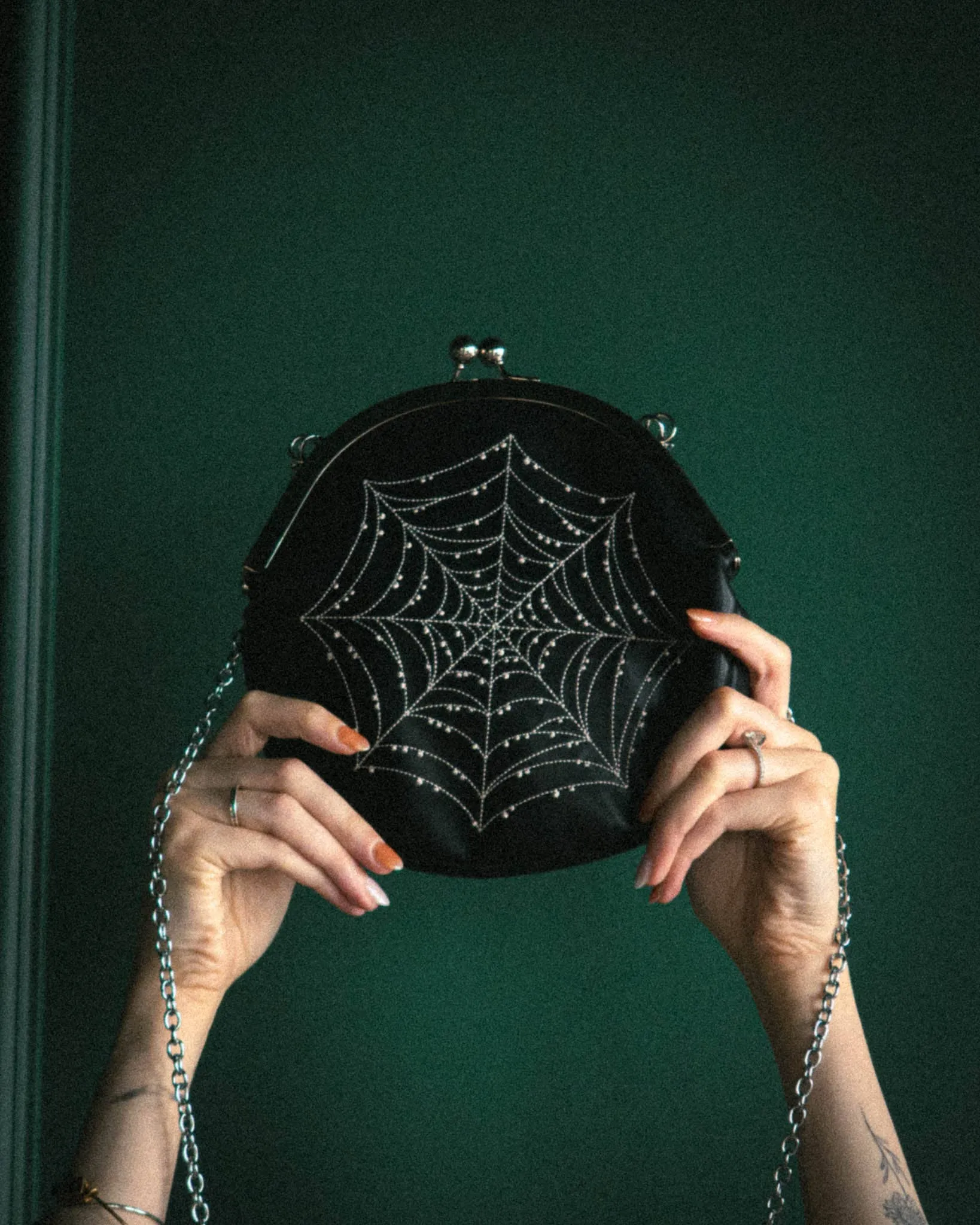 Spiderweb Convertible Clasp Handbag in Black